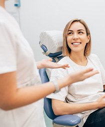 Lady smiles at dentist